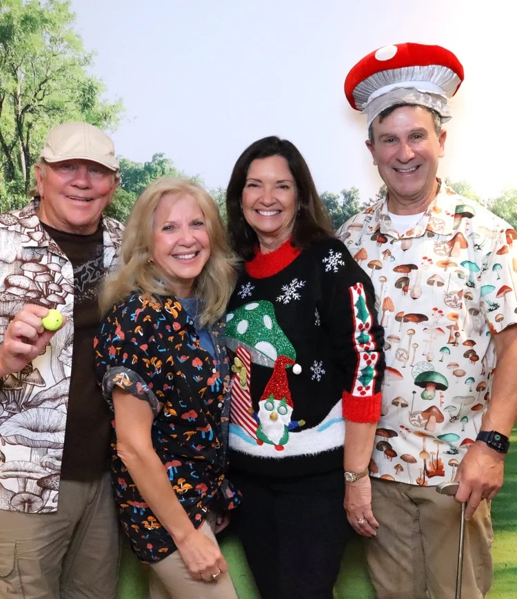 A foursome in mushroom-themed costumes at the 2025 Living Room Invitational
